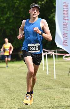 This photo is of Joe Bates. It was taken by Racing Line Running